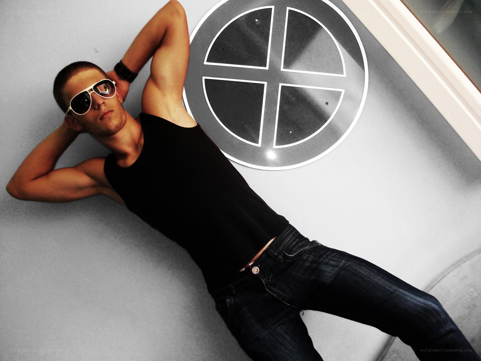 man in sunglasses lying on floor