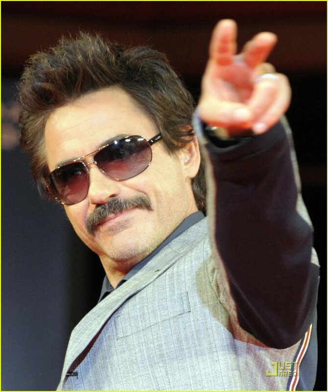 man in sunglasses making peace sign