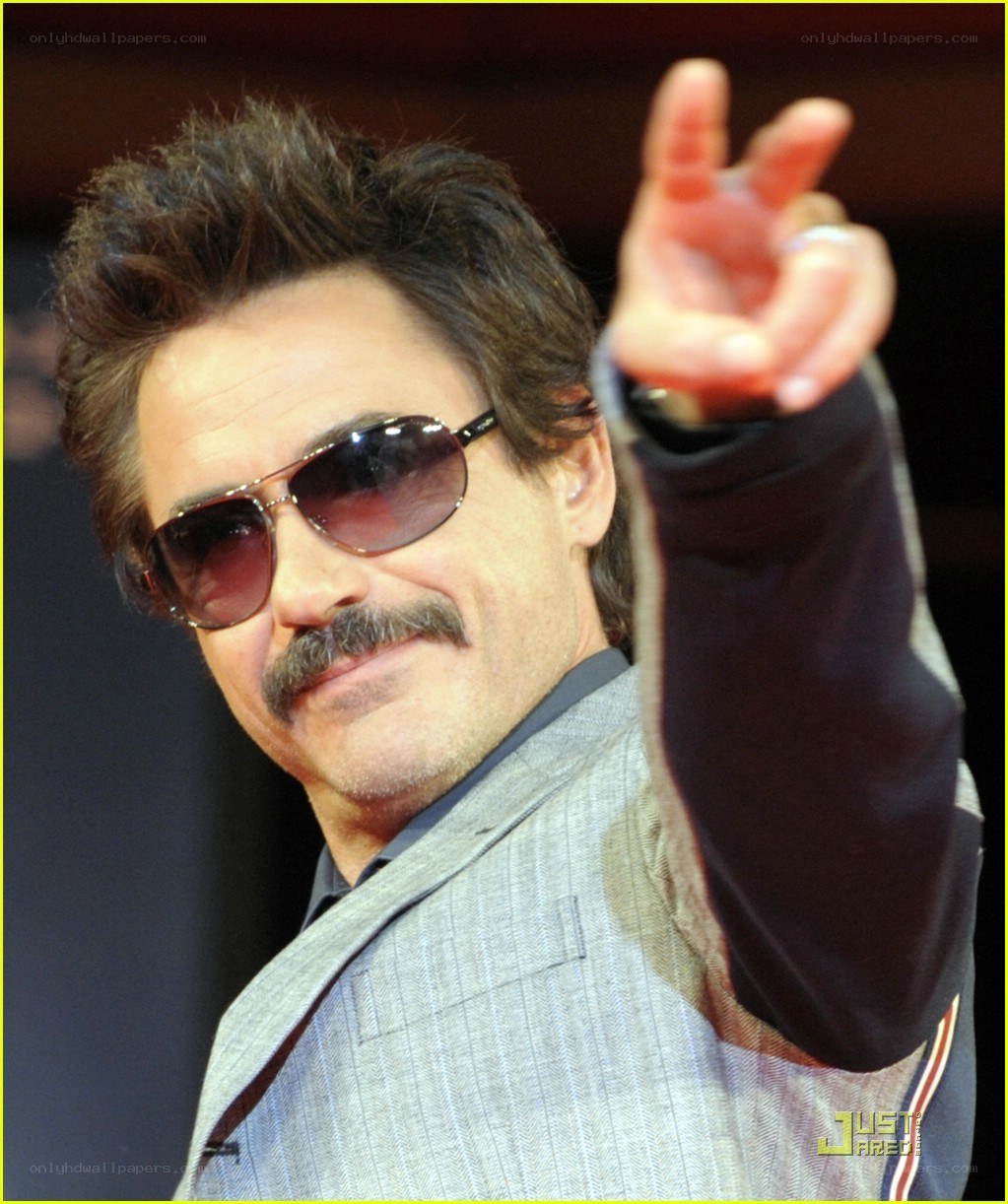 man in sunglasses making peace sign