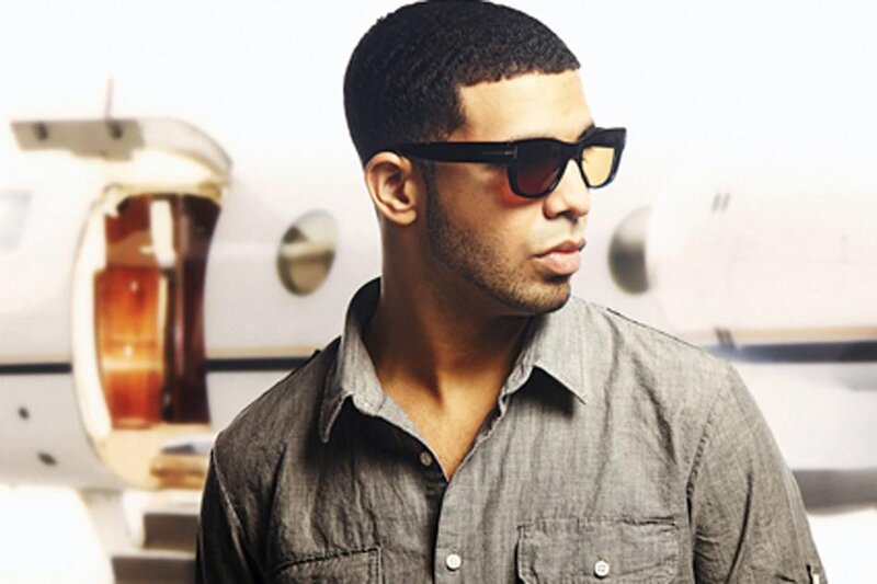 man in sunglasses near private jet