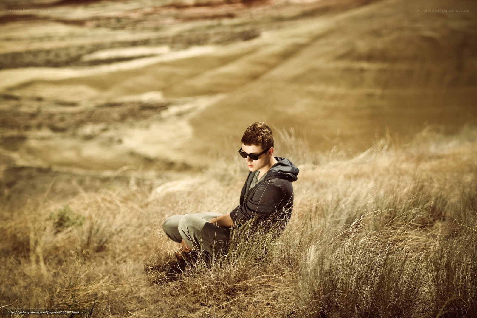 Man in sunglasses on a hill