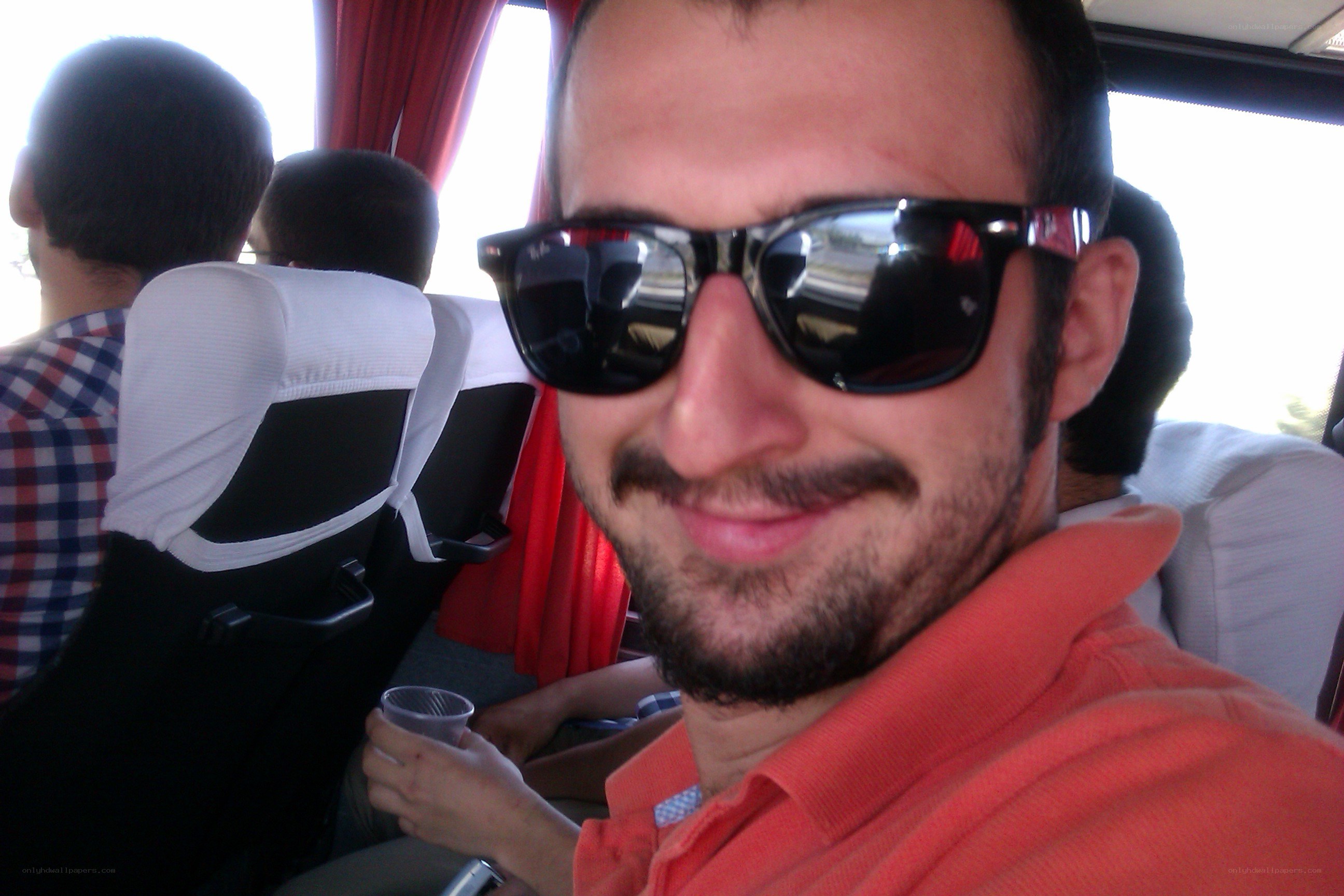 man in sunglasses on bus