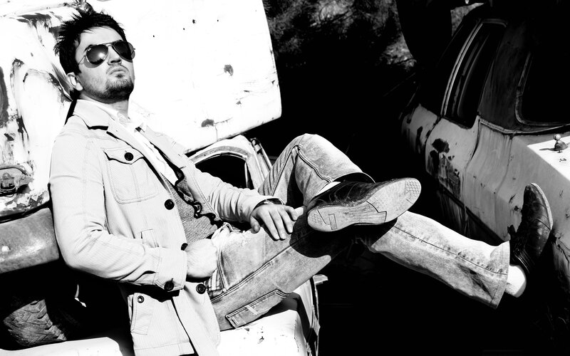 man in sunglasses on car