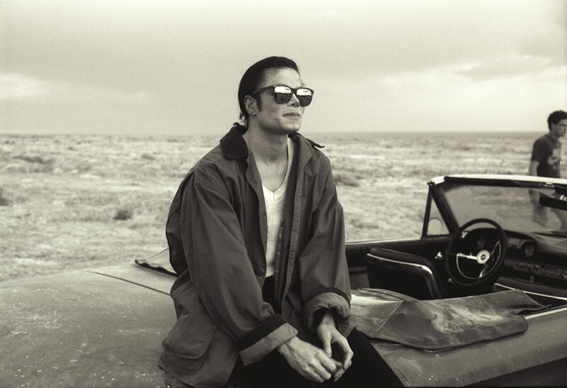 Man in Sunglasses on Car — Black