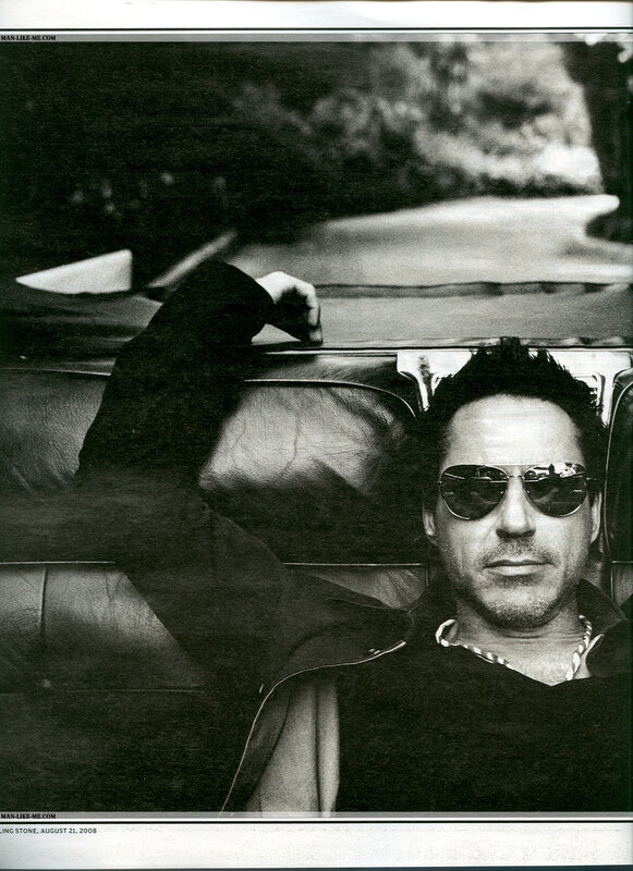 man in sunglasses on car