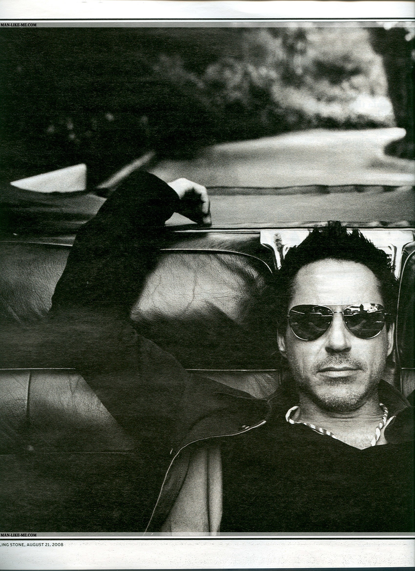 man in sunglasses on car
