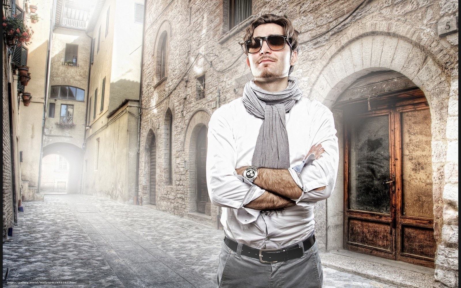 Man in sunglasses on cobblestone street