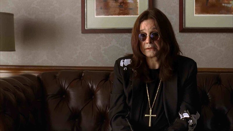 man in sunglasses on couch