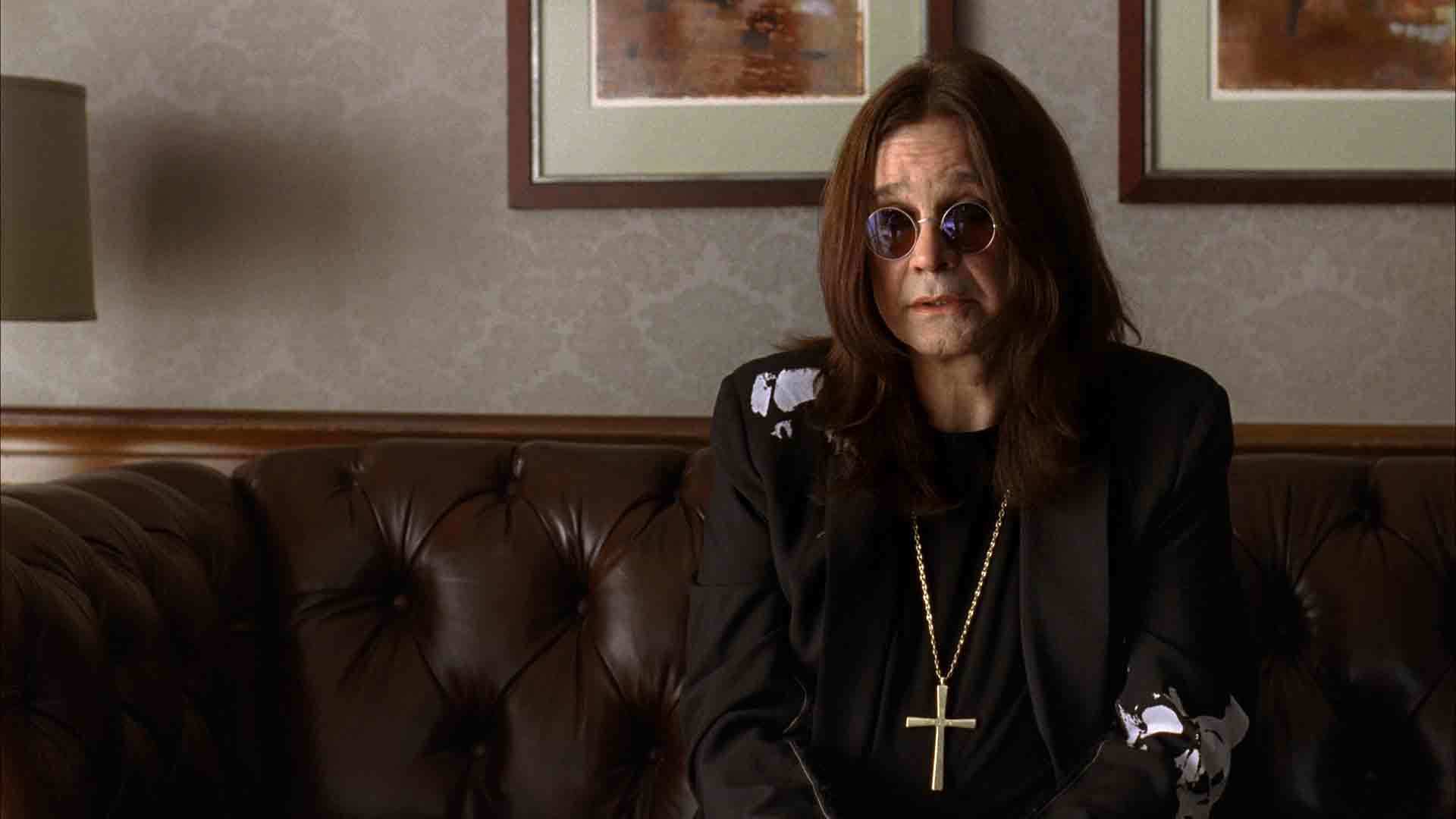 man in sunglasses on couch