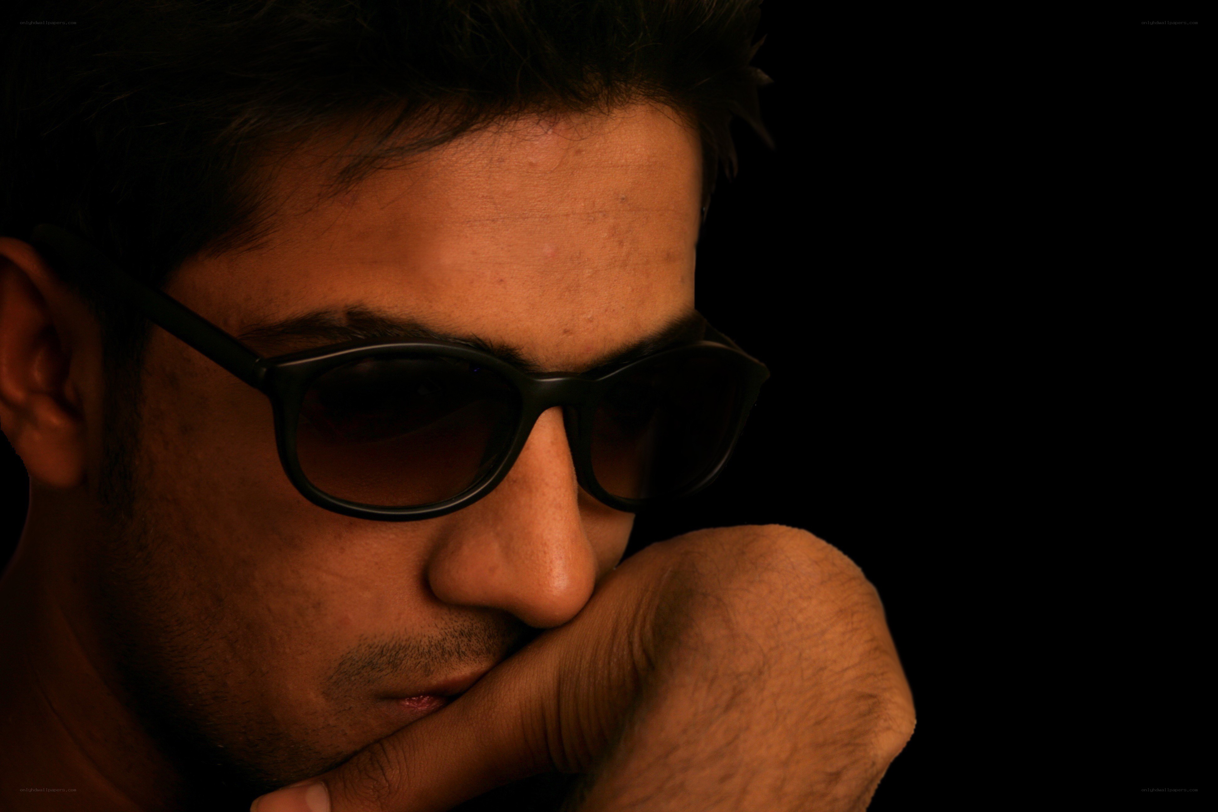 man in sunglasses thinking