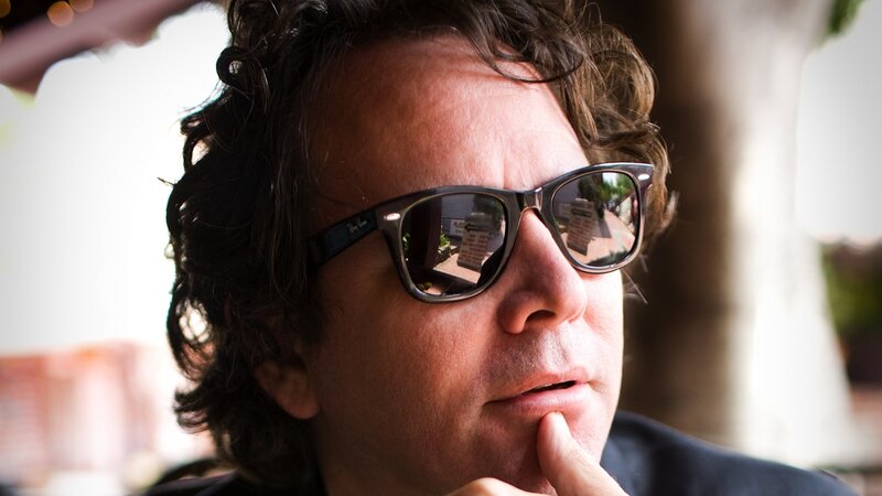 man in sunglasses thinking