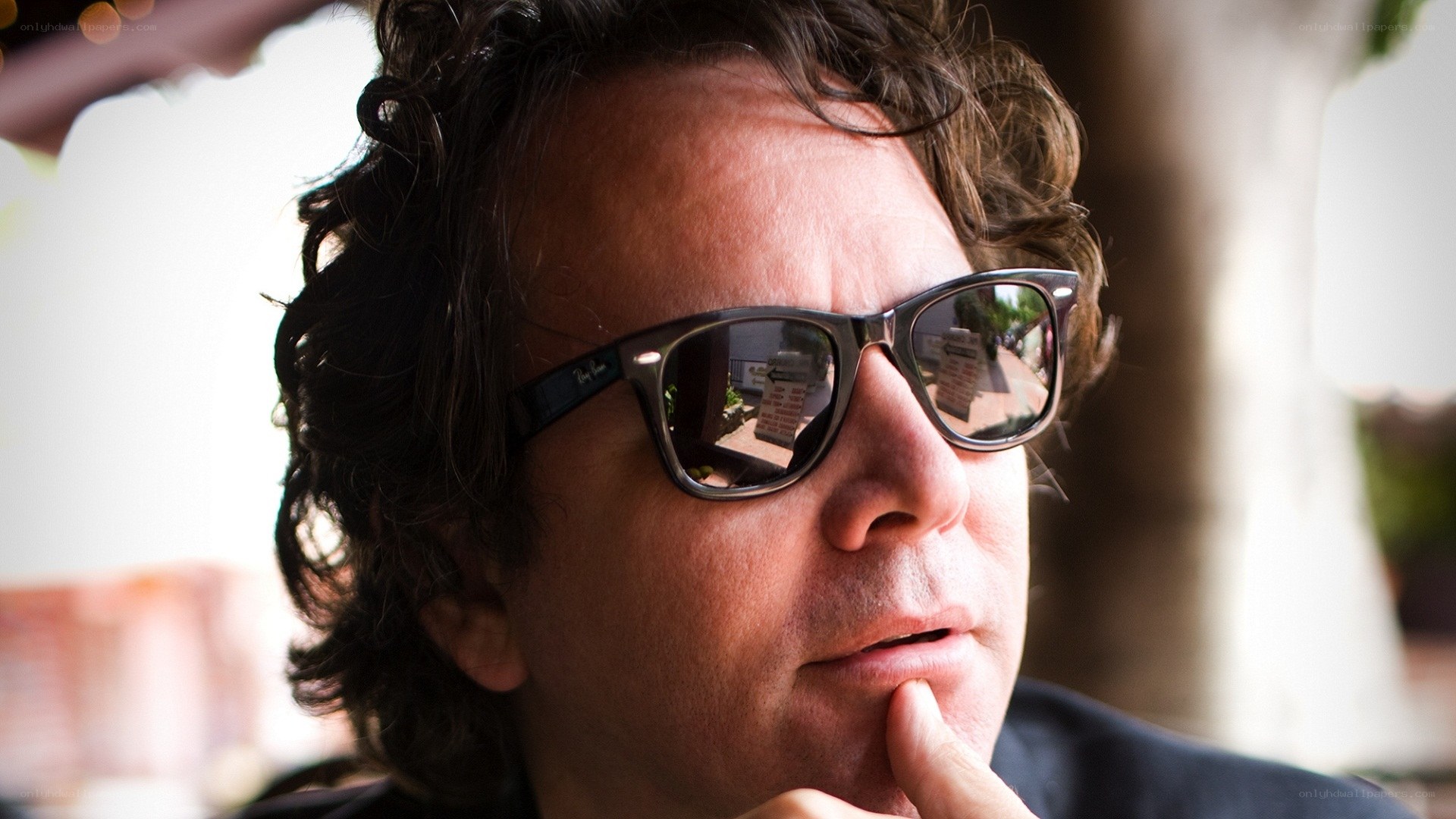 man in sunglasses thinking