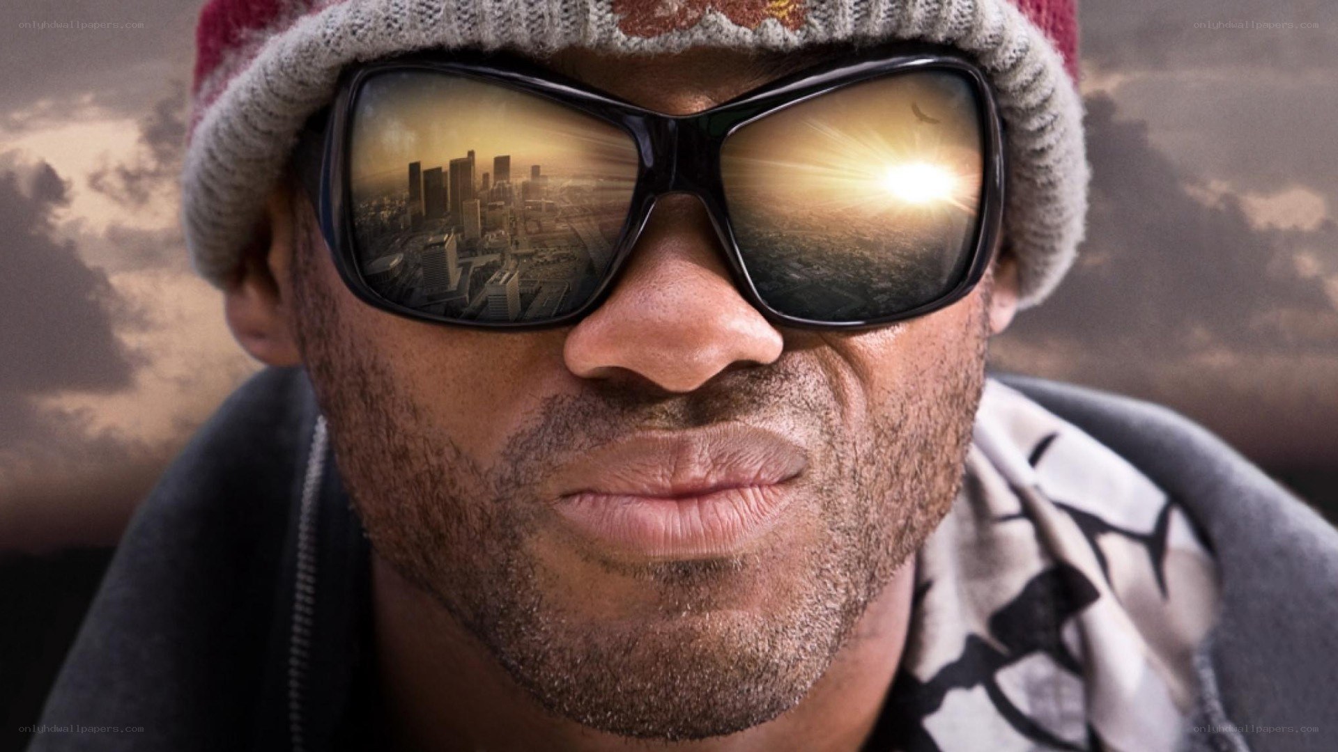 man in sunglasses with city reflection
