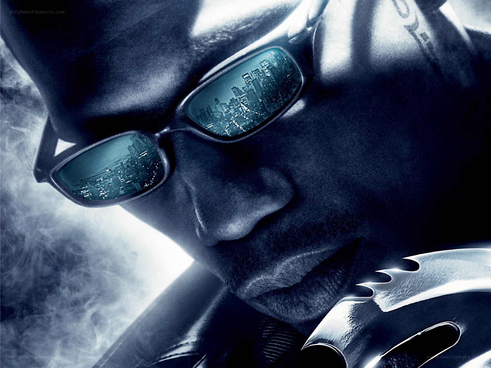 Man in sunglasses with city reflection