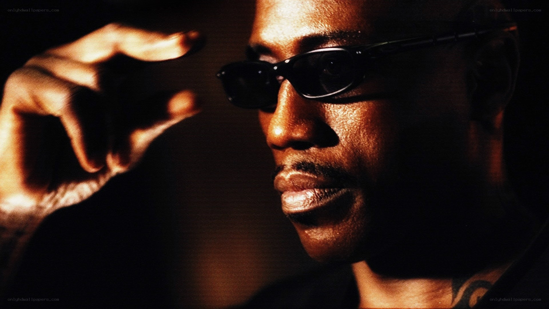 man in sunglasses with hand gesture