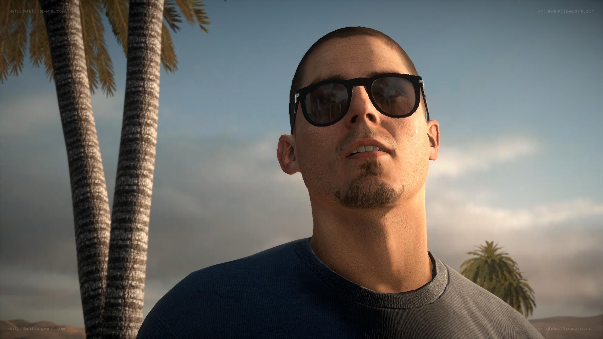 man in sunglasses with palm trees