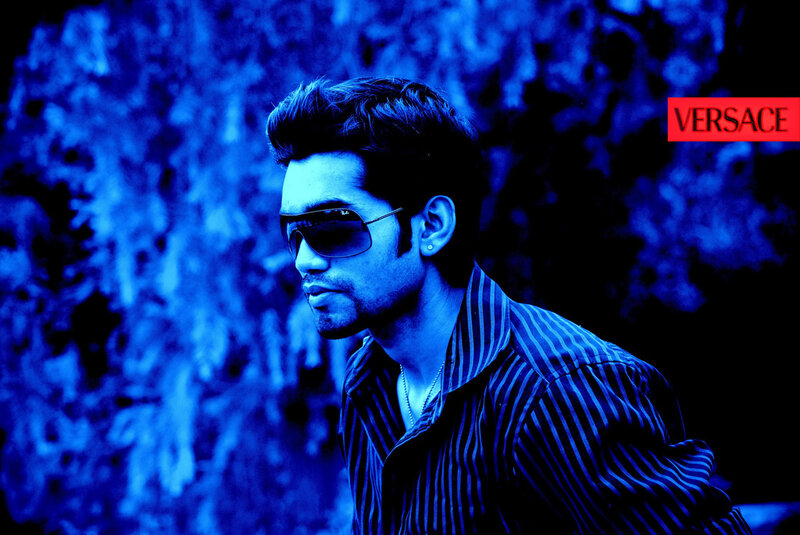 man in sunglasses with versace logo