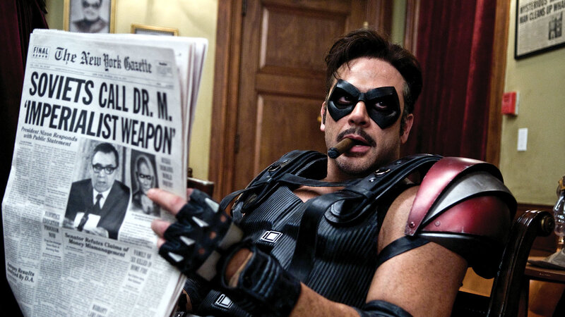 Man in superhero costume reading newspaper