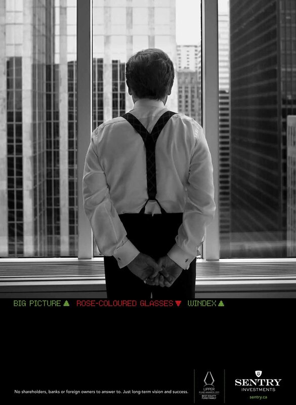 Man in suspenders at window