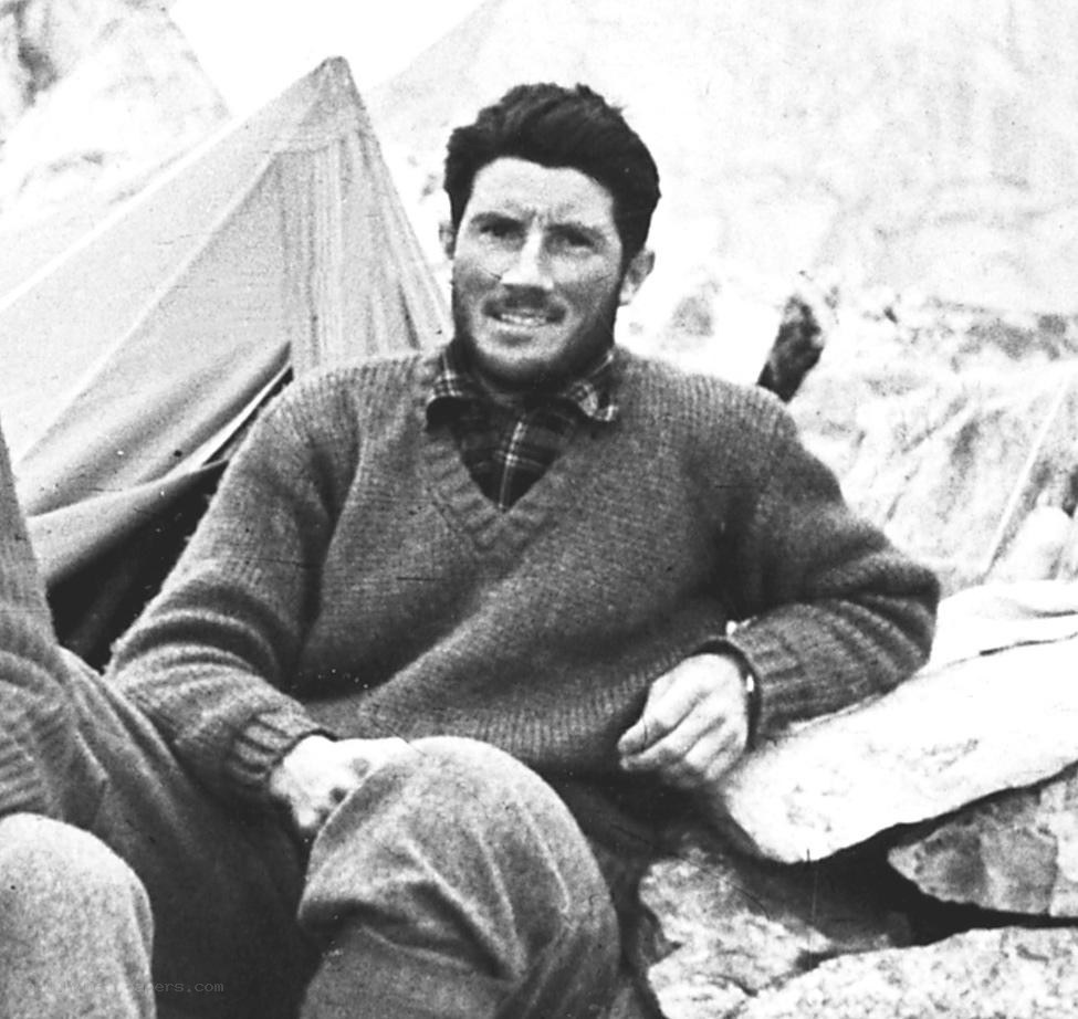 man in sweater at camp