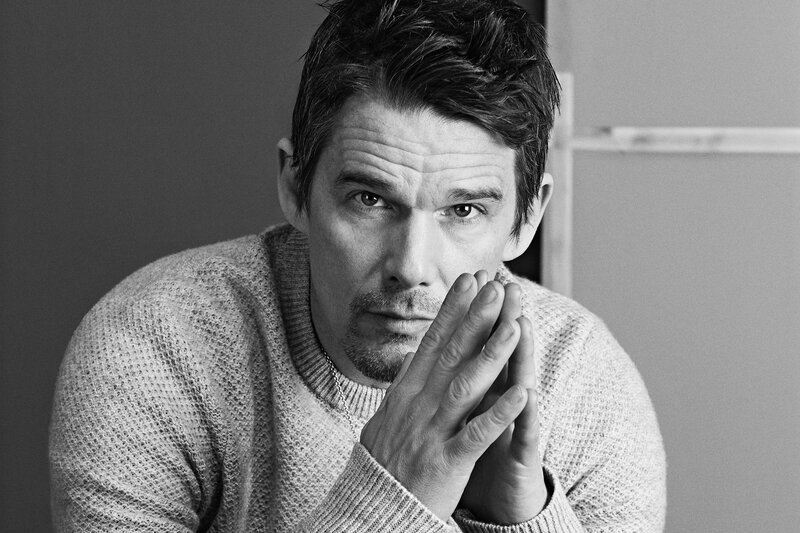 man in sweater looking at camera