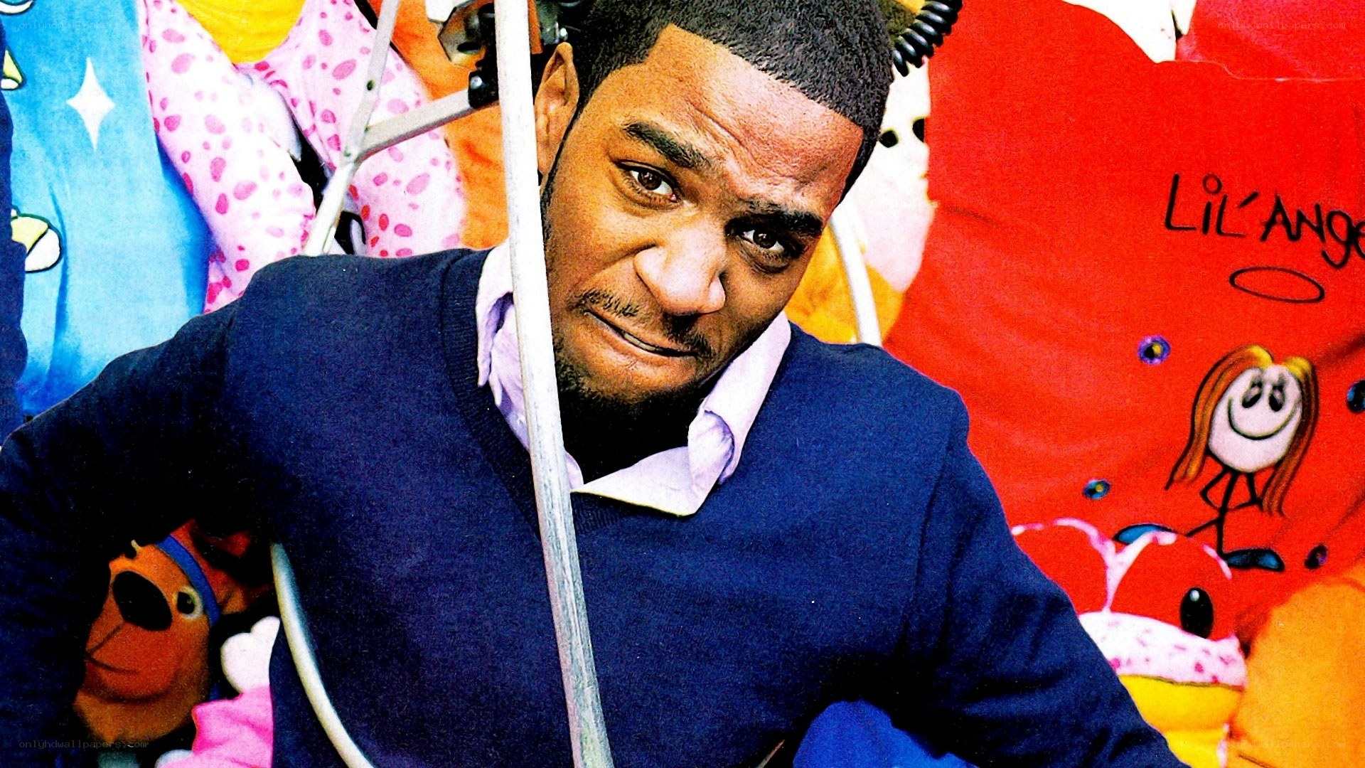 man in sweater with toys