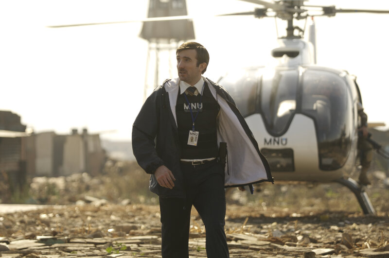 Man in tactical gear near helicopter
