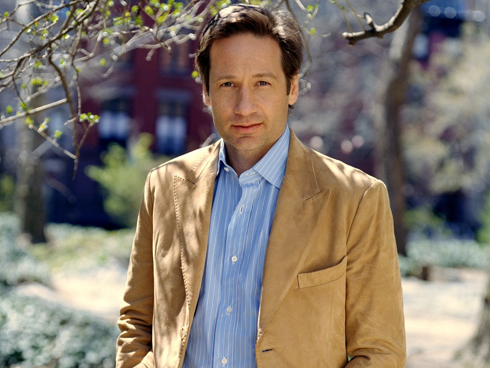 man in tan jacket outdoors