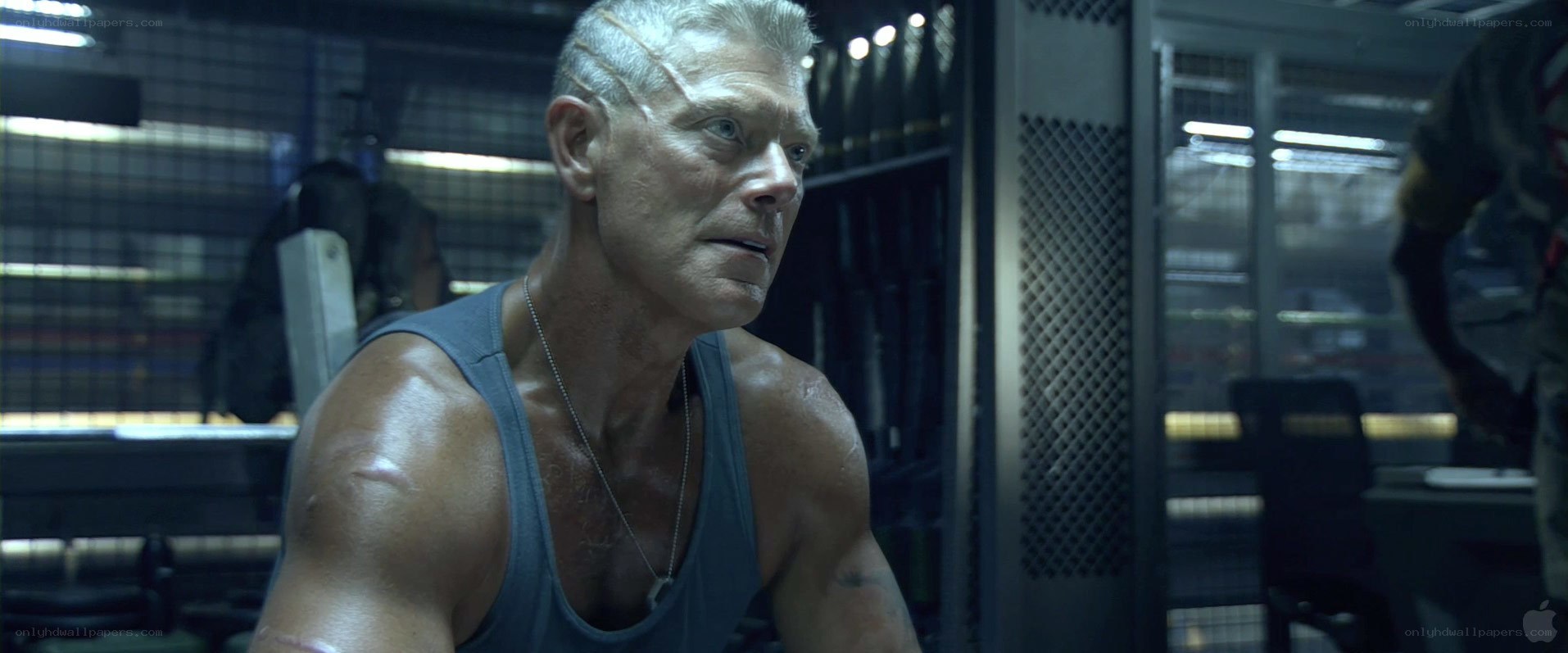 man in tank top looking serious