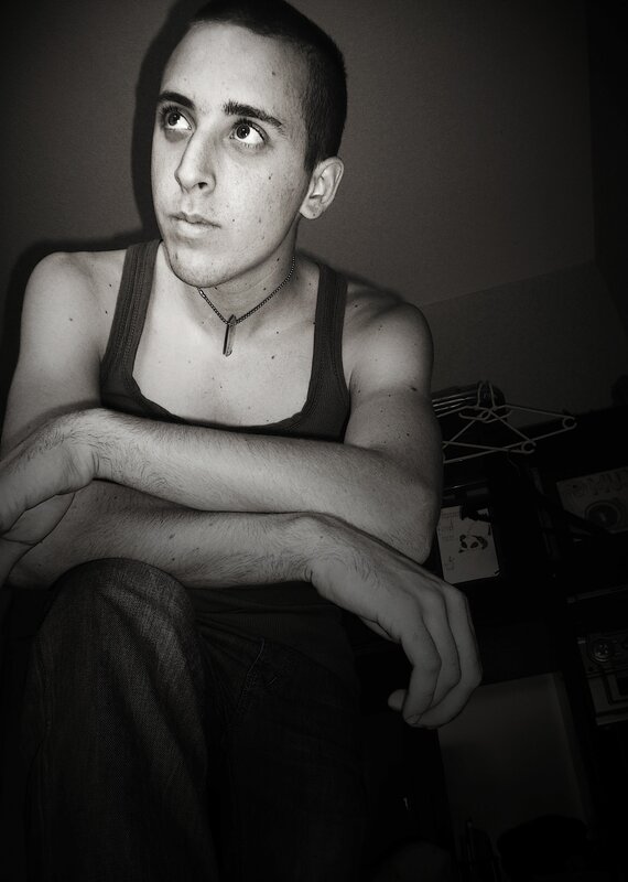 man in tank top looking up