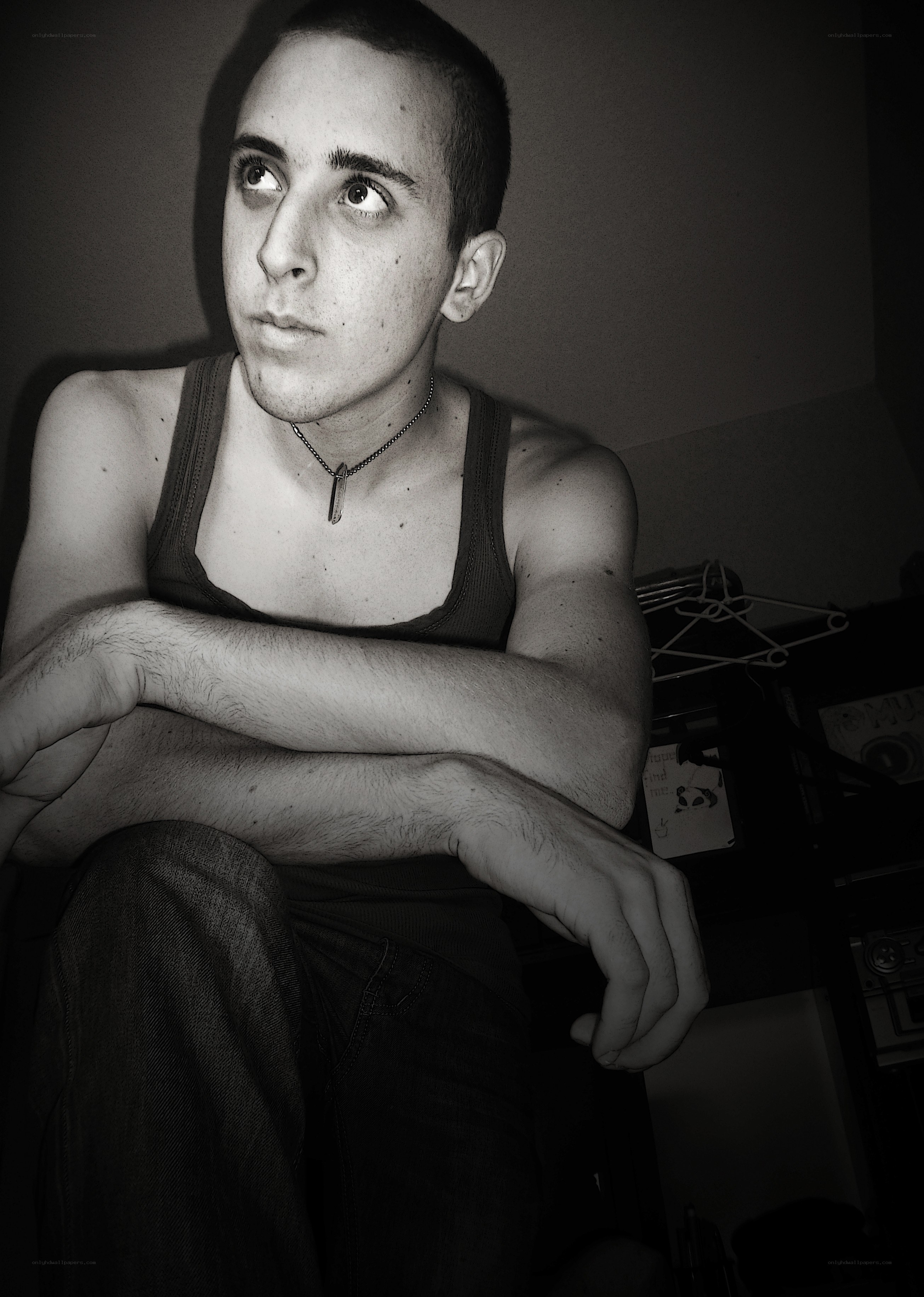 man in tank top looking up