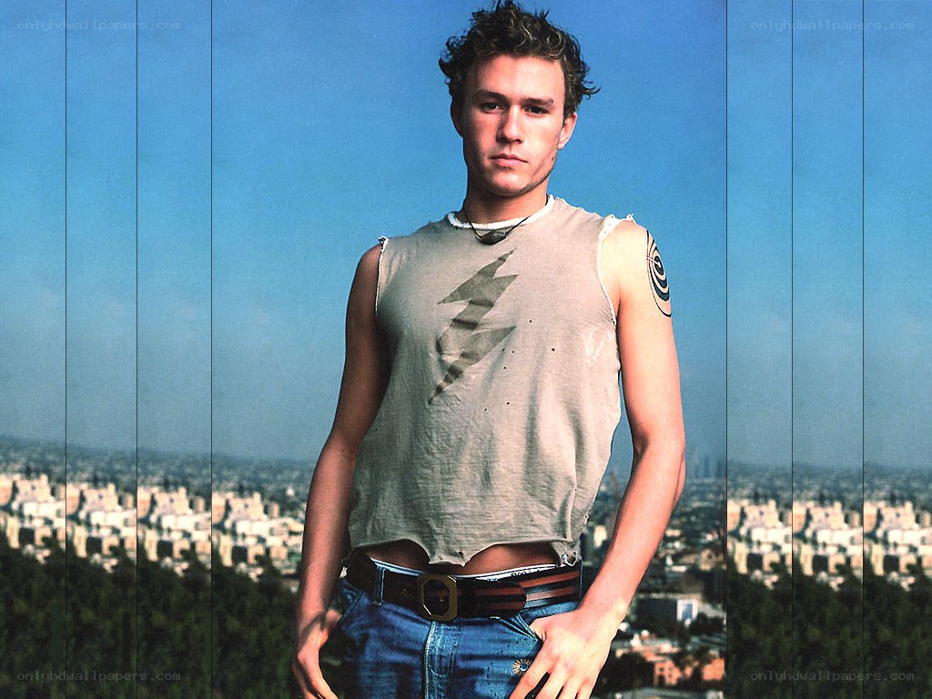man in tank top with city view