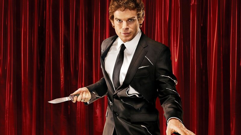 man in tattered suit holding knife