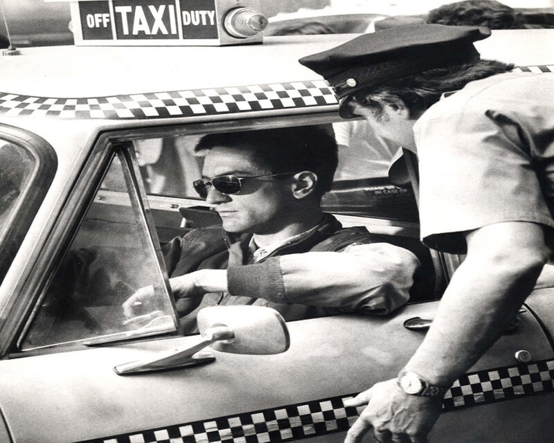 Man in Taxi with Police Officer