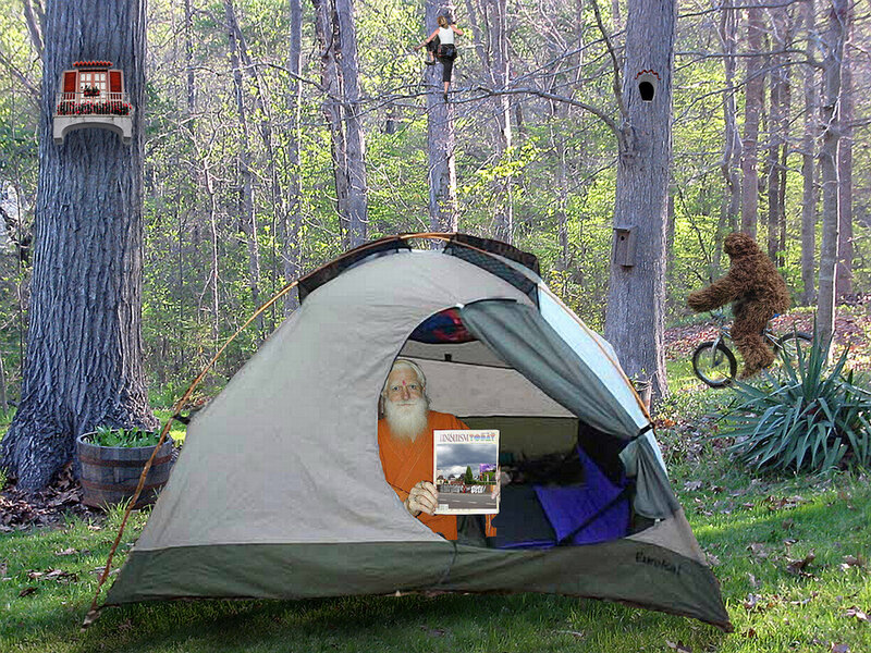 Man in tent with magazine