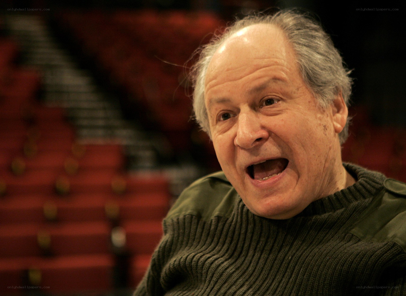 man in theater laughing