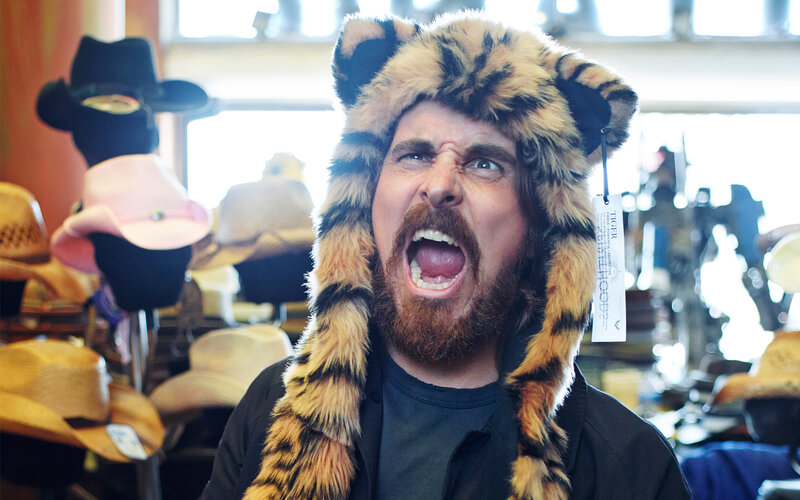 Man in tiger hat shouting