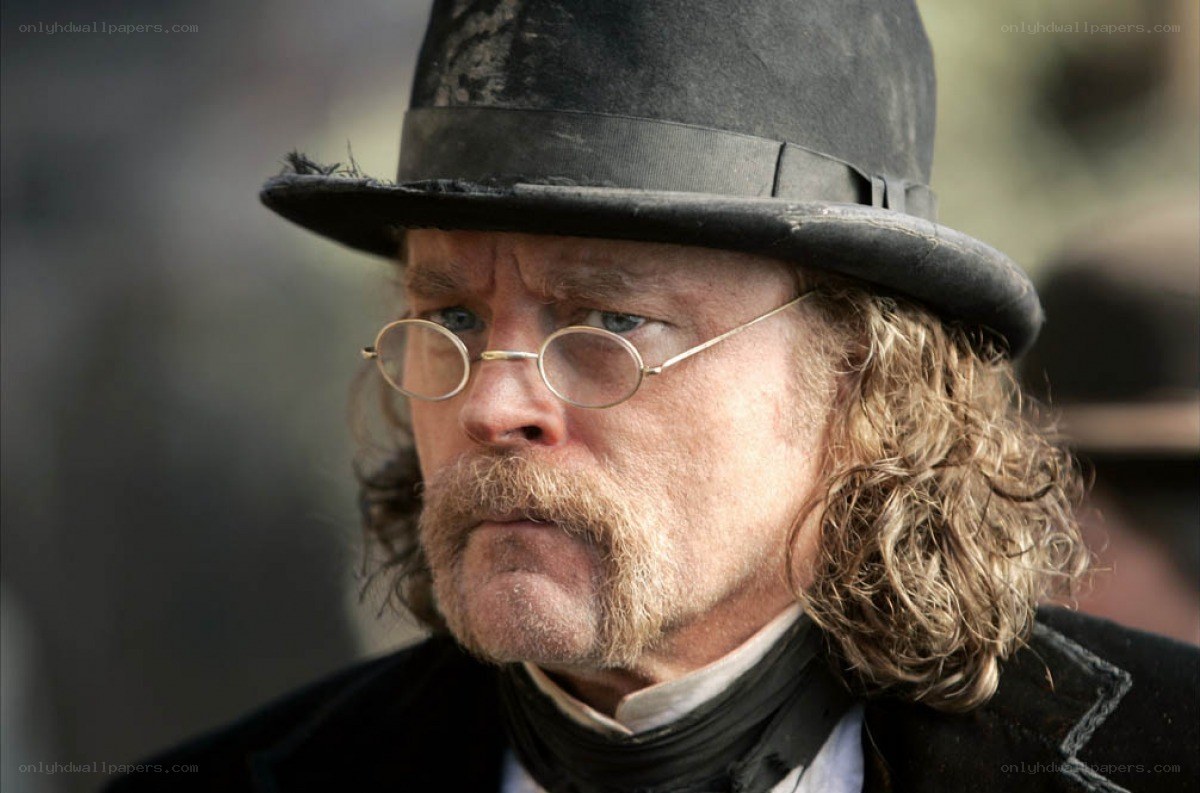 man in top hat and glasses