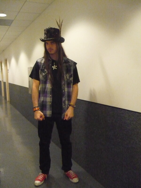 man in top hat and plaid vest