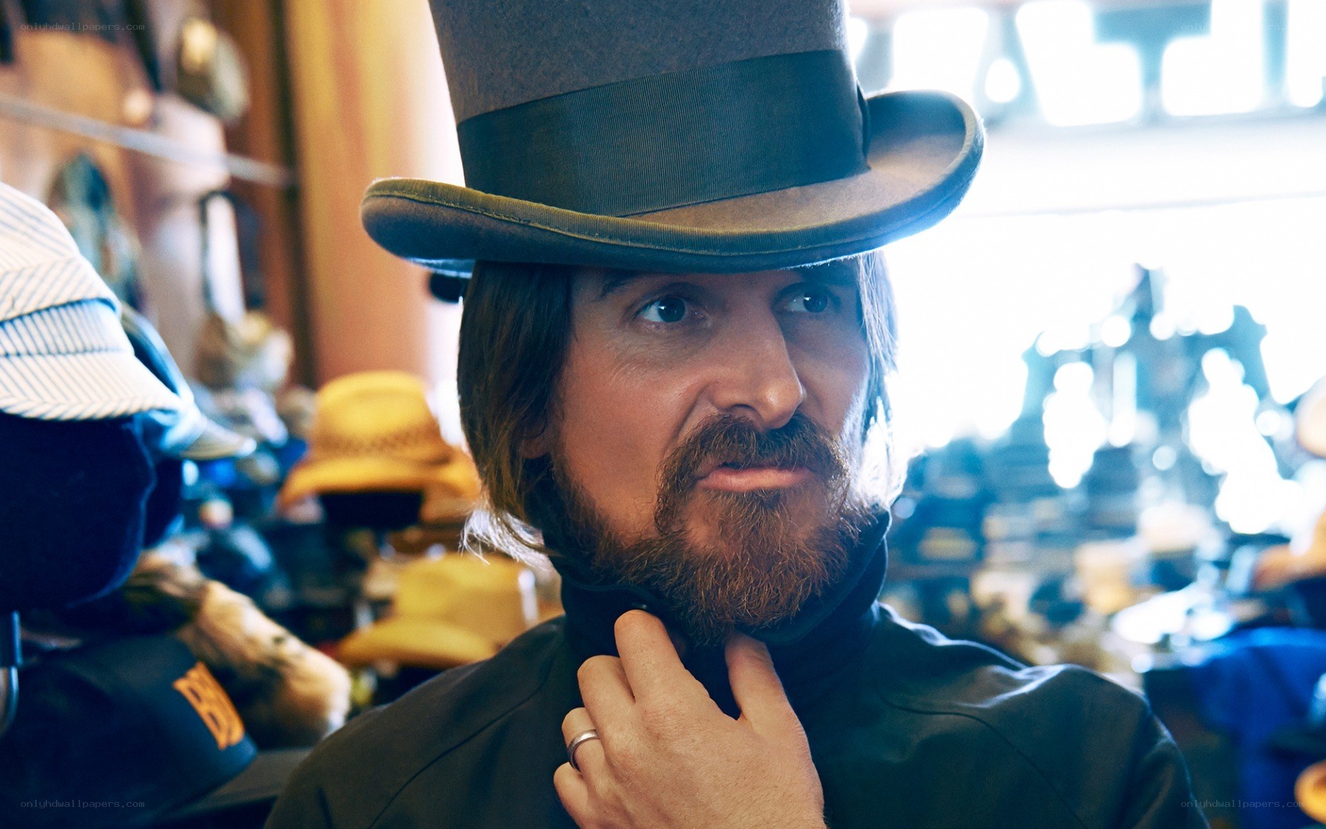 Man in top hat at hat shop