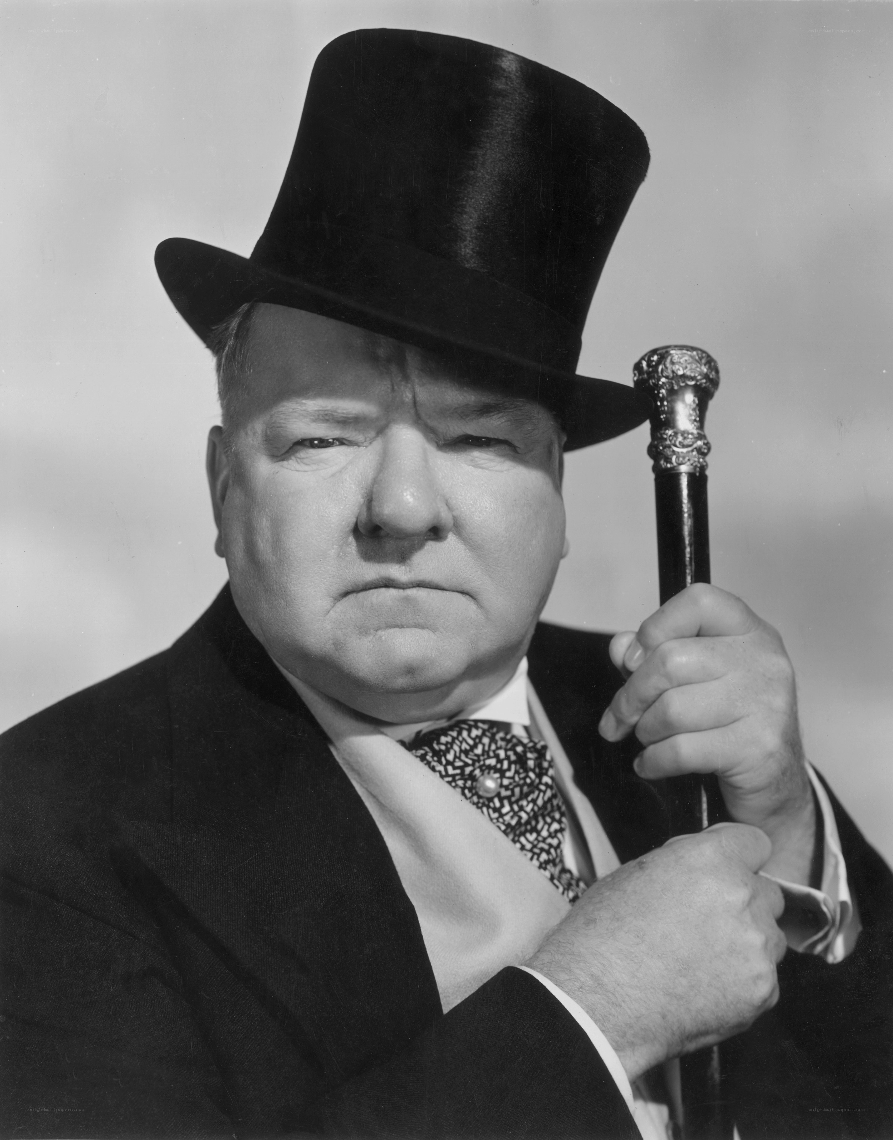 Man in top hat holding cane