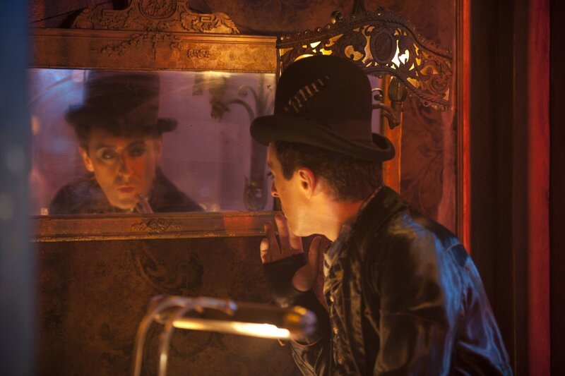 Man in Top Hat Looking at Mirror