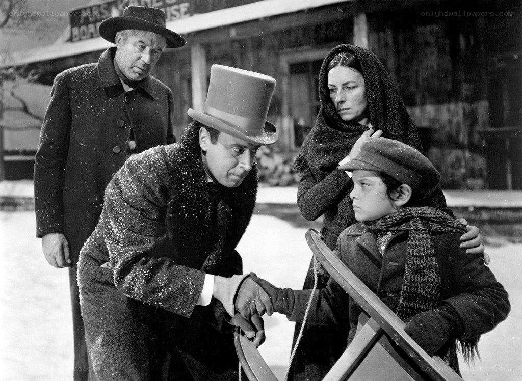 Man in top hat with family