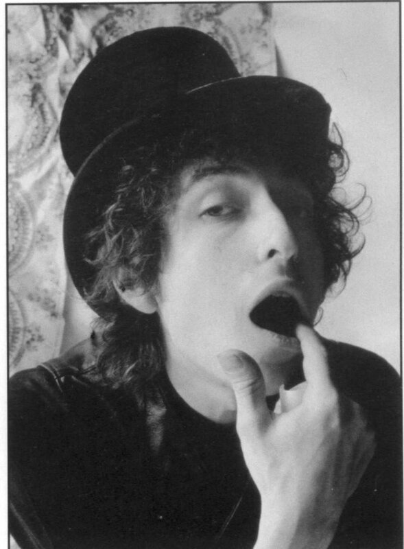 man in top hat with hand on chin