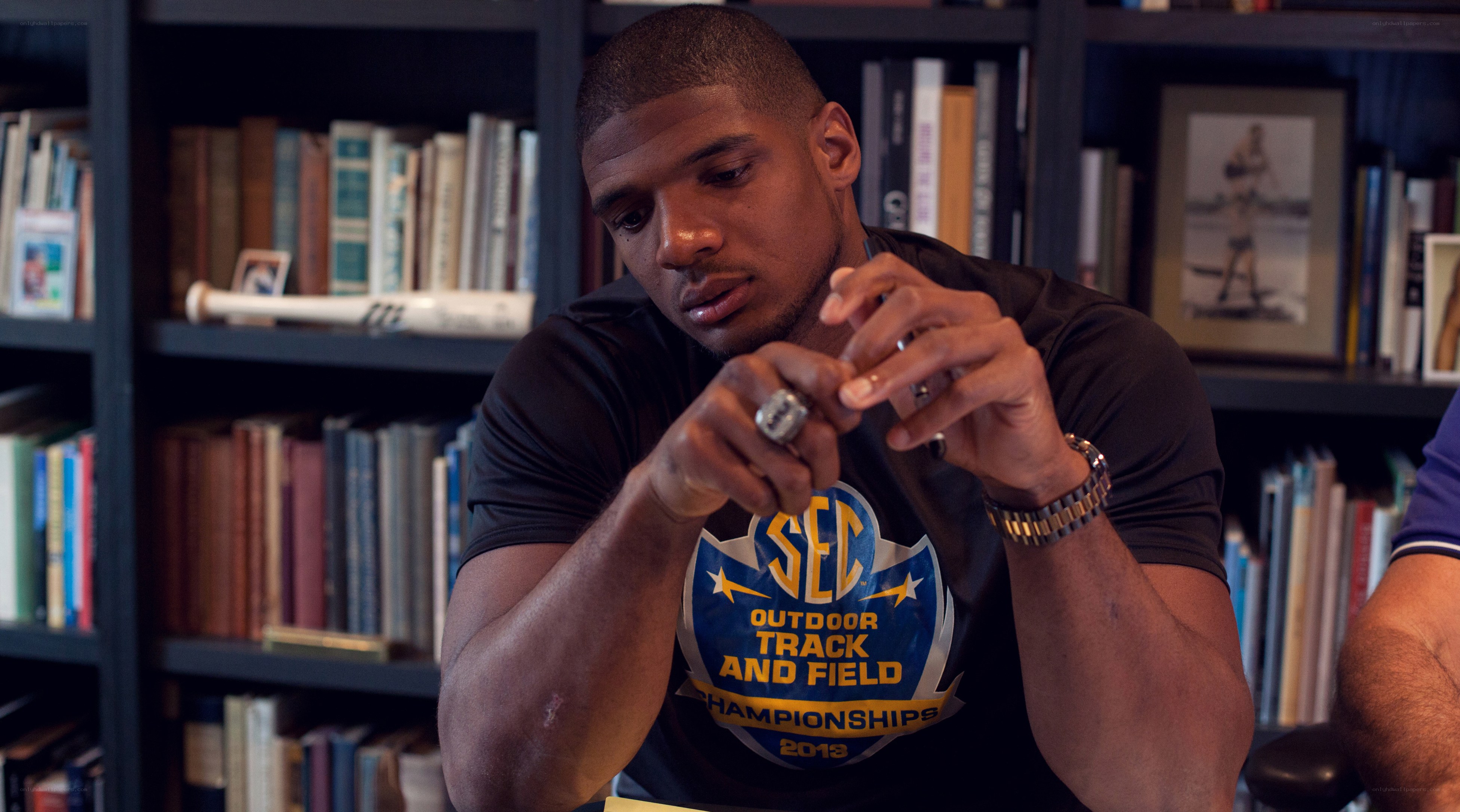 man in track and field shirt