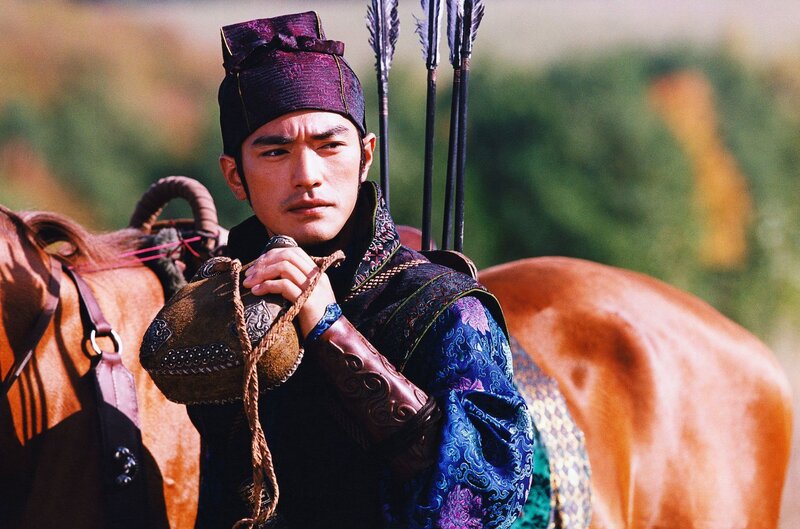 man in traditional armor with horse