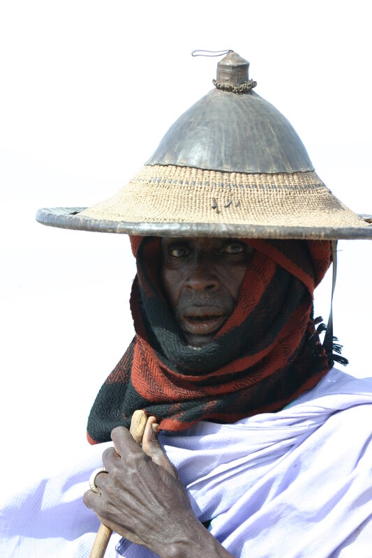 Man in traditional hat and scarf