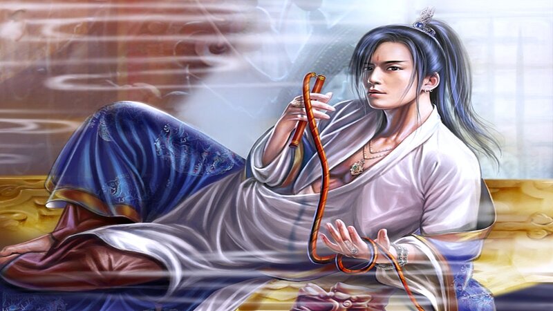 man in traditional robes holding a staff