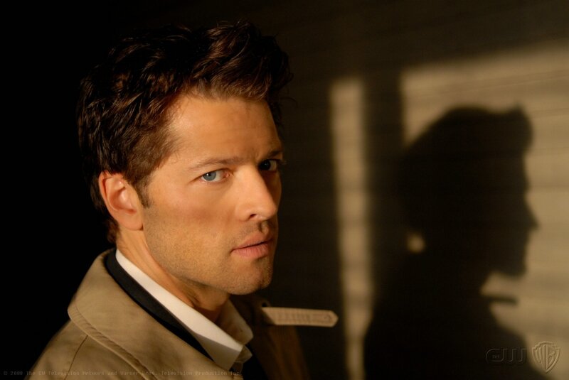 man in trench coat looking