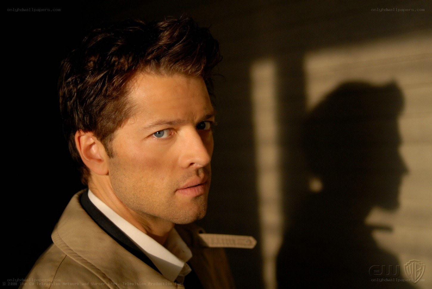 man in trench coat looking
